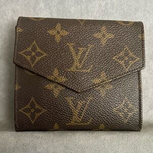 LV Double Side Wallet. Very good condition. No tears. Clasp works great!